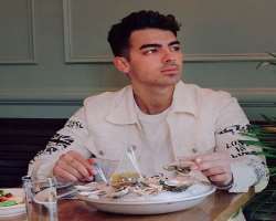 Joe Jonas eating non vegetarian food Joe Jonas eating non vegetarian food